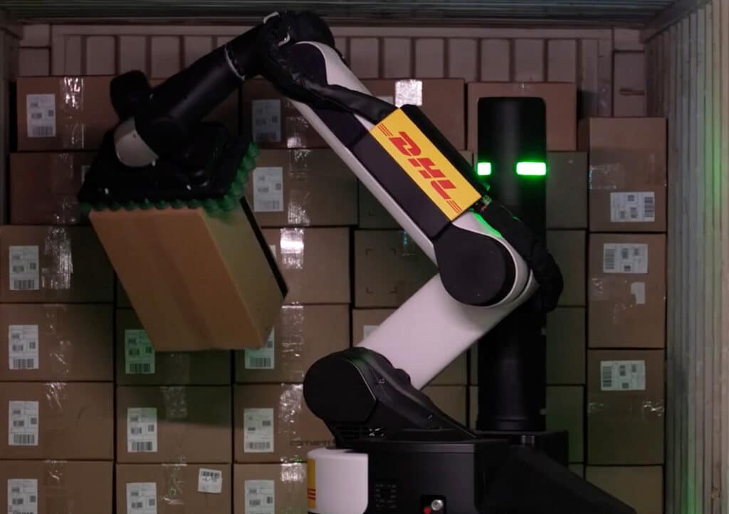 A DHL-branded Stretch robot unloads freight from a trailer